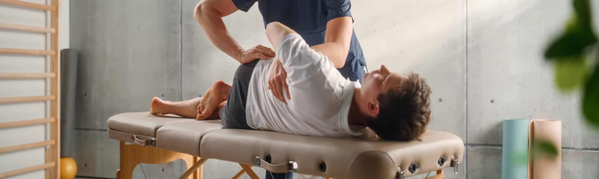 chiropractor making adjustments to patient after using a luxury massage chair