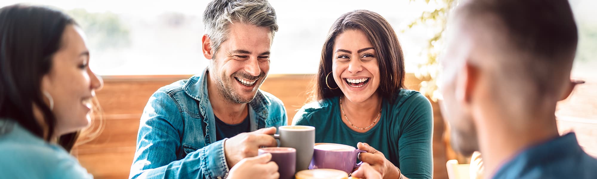 People enjoying coffee together. Massage and massage chairs provide mental health benefits that can improve your social life